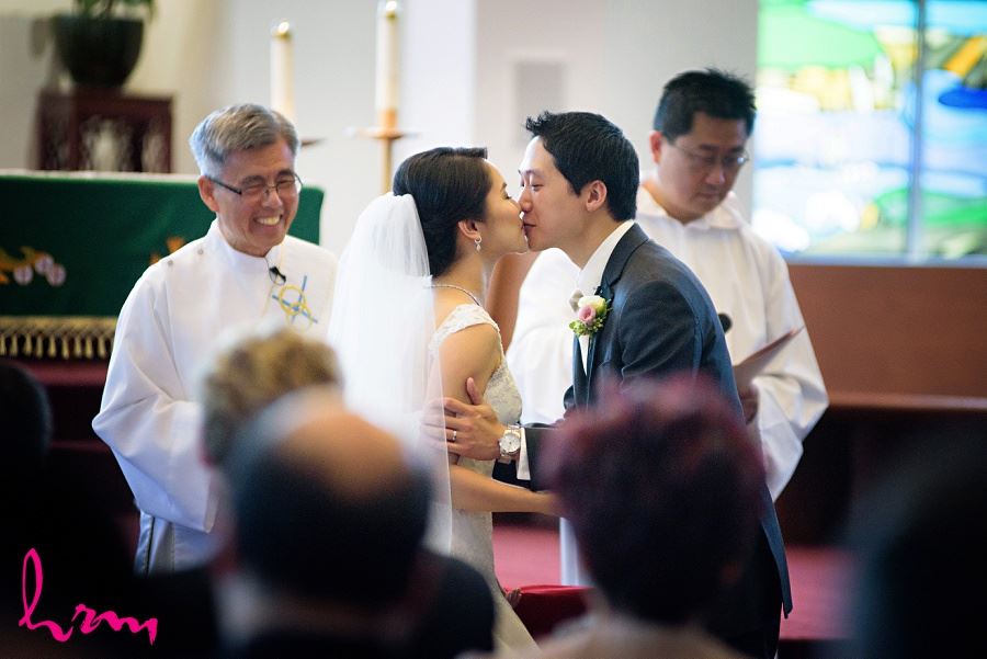 The kiss at Chinese Martyrs Catholic Church Toronto ON Wedding Photography