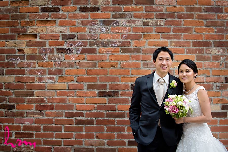 Natalie and Michael by brick wall in Unionville Toronto ON Wedding Photography