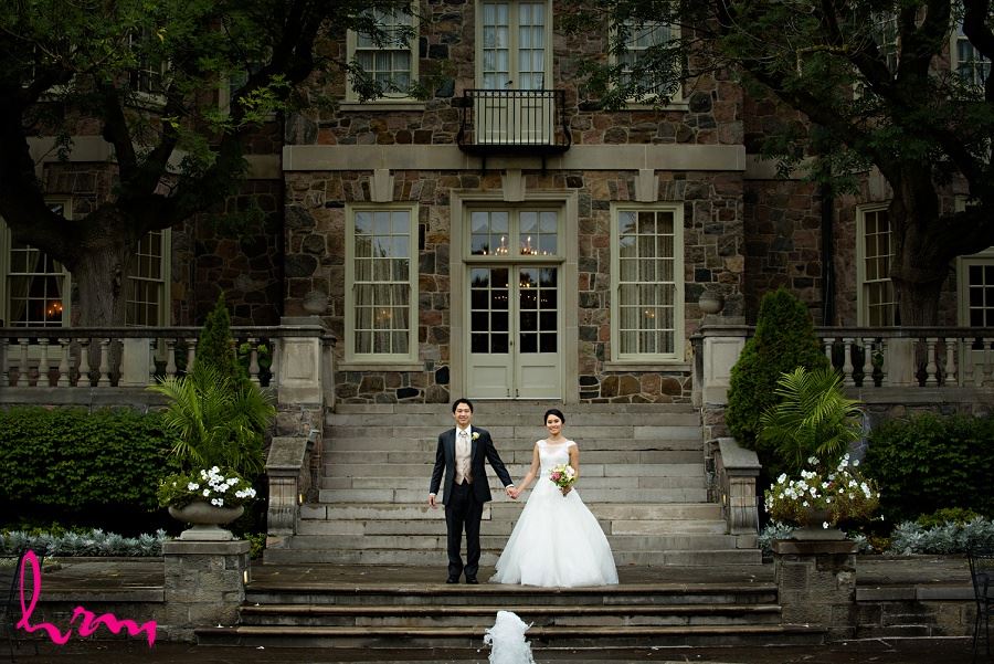 Natalie and Michael by fountains at Graydon Hall Manor Toronto ON Wedding HRM Photography