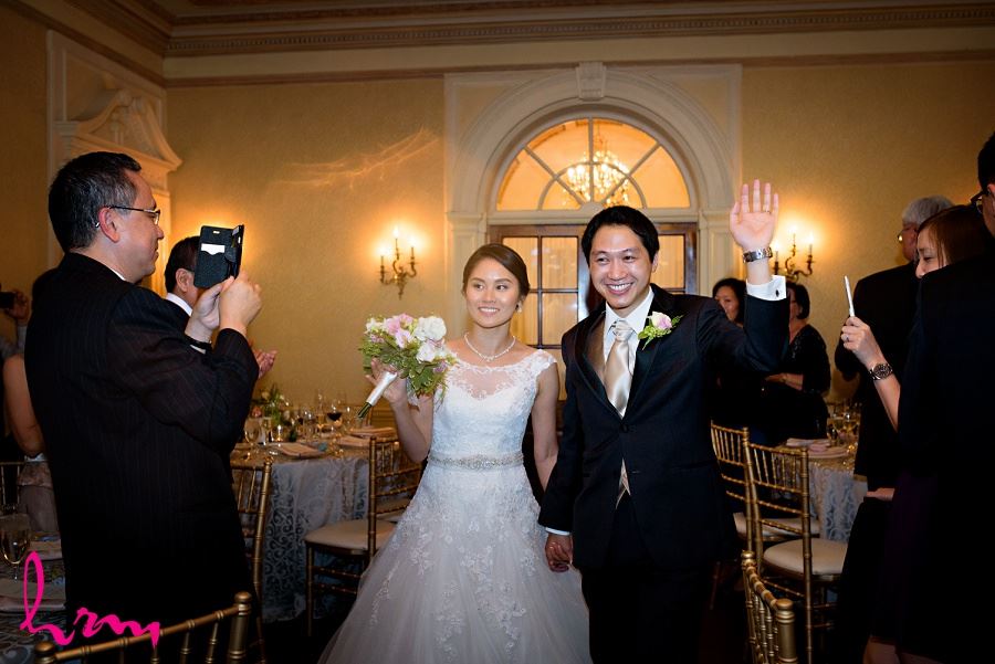 Natalie and Michael enter at Graydon Hall Manor Toronto ON Wedding Photography