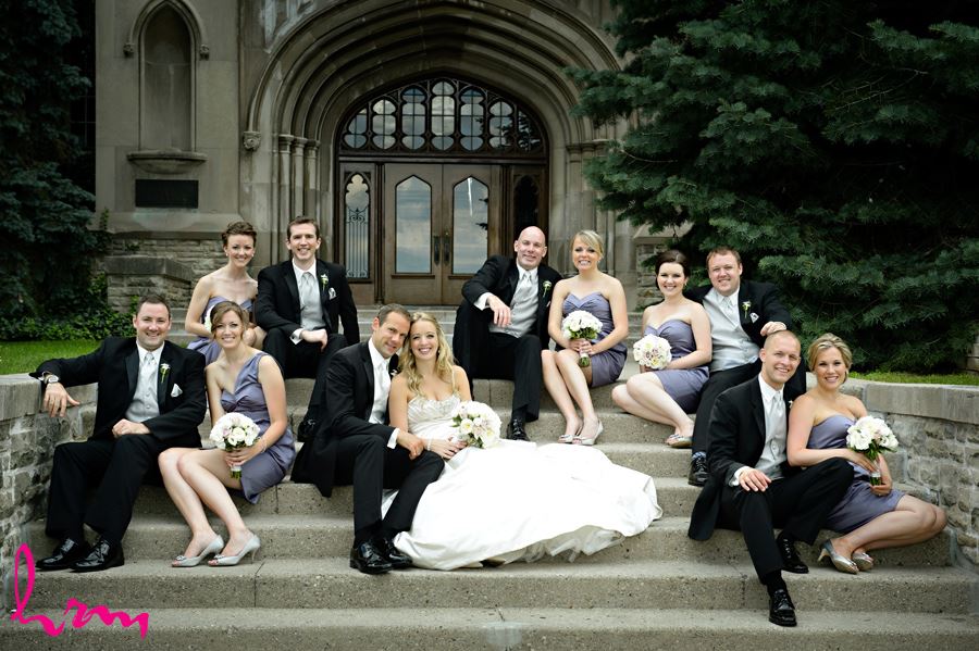 Bride and Groom with their bridal party on the steps of University College at Western University