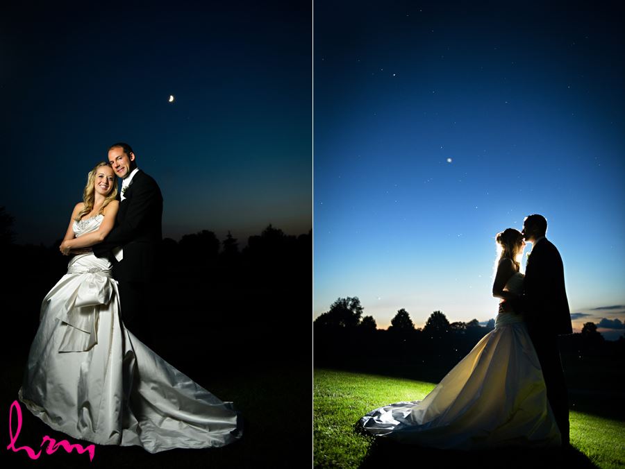 Groom kissing brides forehead in front of a starry night sky