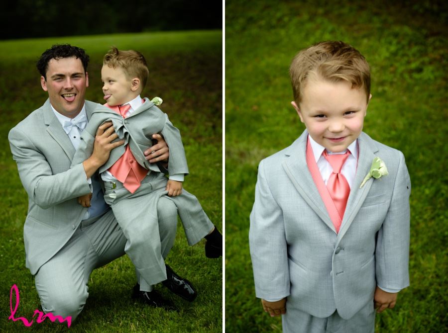 Ring bearer in gray suit and coral tie