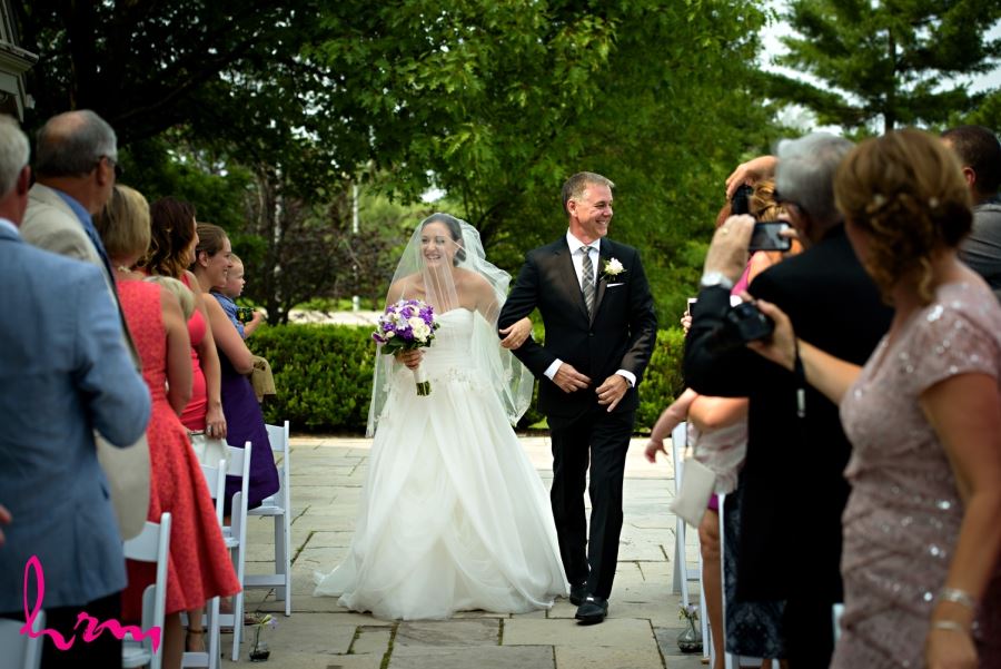 bride and father walking down aisle wedding day